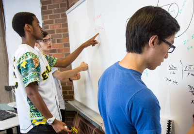 Students learning in small groups